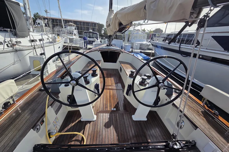 Slide: The Image of 2018 Tofinou 12 sailboat cockpit with dual steering wheels, docked at marina. - 5