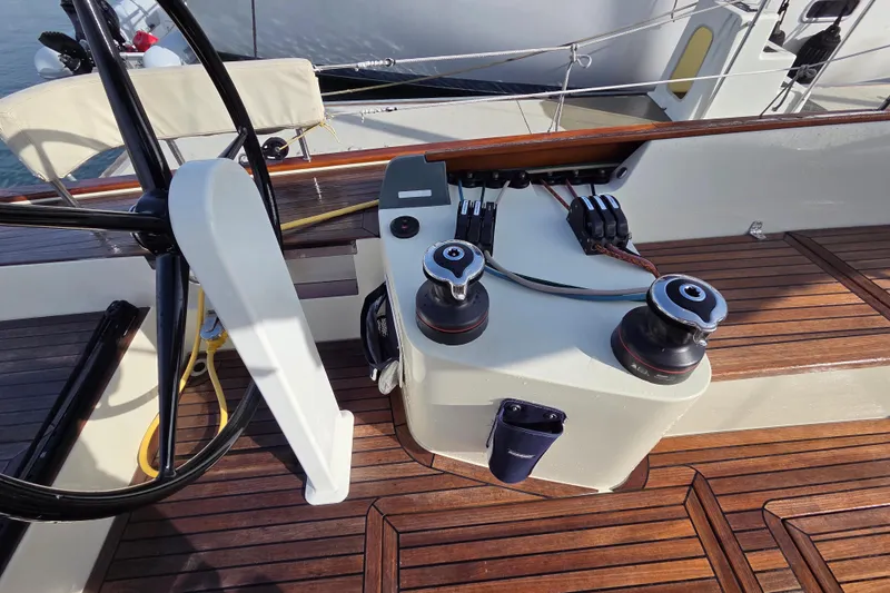 Slide: The Image of 2018 Tofinou 12 yacht cockpit with wooden deck and steering wheel. - 9