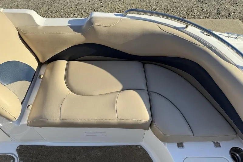 Slide: The Image of 2015 Hurricane SunDeck Sport 202 IO boat seating, beige and blue upholstery, sleek design. - 1