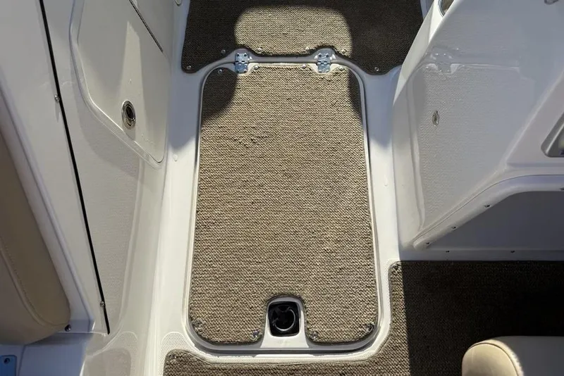 Slide: The Image of 2015 Hurricane SunDeck Sport 202 IO boat interior with carpeted flooring. - 18