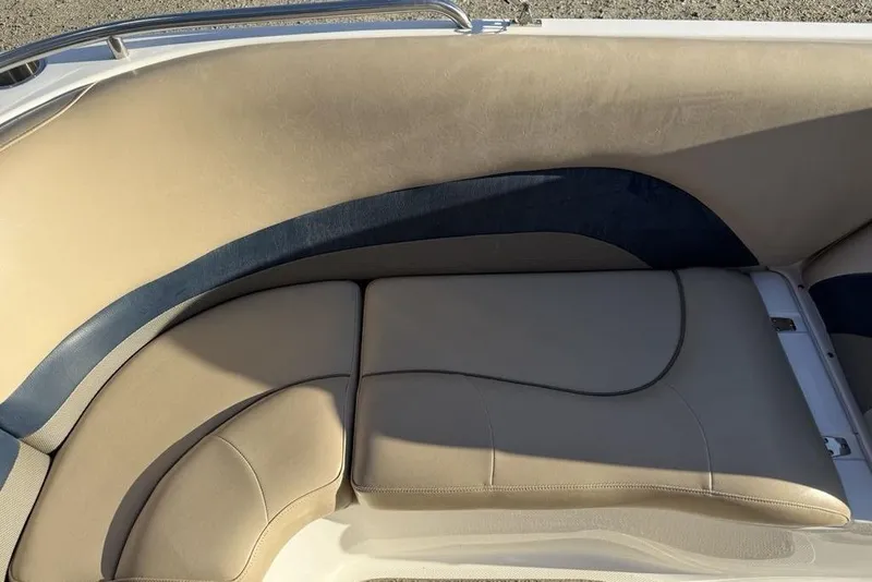 Slide: The Image of 2015 Hurricane SunDeck Sport 202 IO boat interior with beige and blue seating. - 21