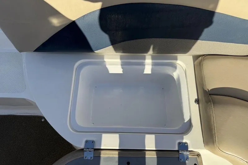 Slide: The Image of 2015 Hurricane SunDeck Sport 202 IO boat storage compartment, open and empty. - 25