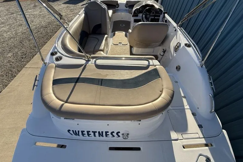 Slide: The Image of 2015 Hurricane SunDeck Sport 202 IO boat interior with seating and steering wheel. - 27