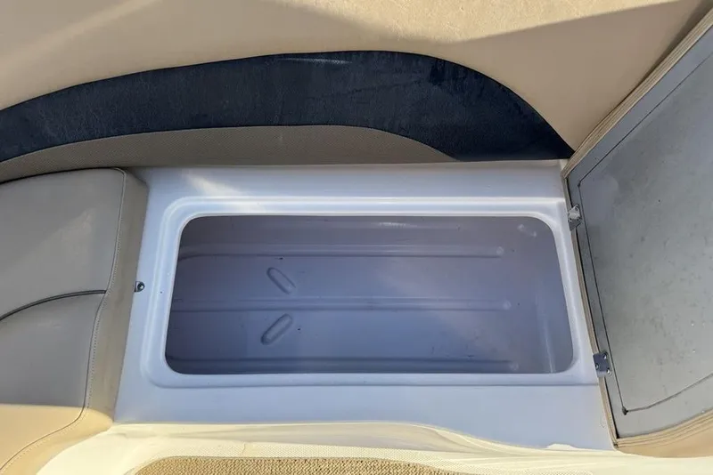 Slide: The Image of 2015 Hurricane SunDeck Sport 202 IO storage compartment, open and empty. - 28