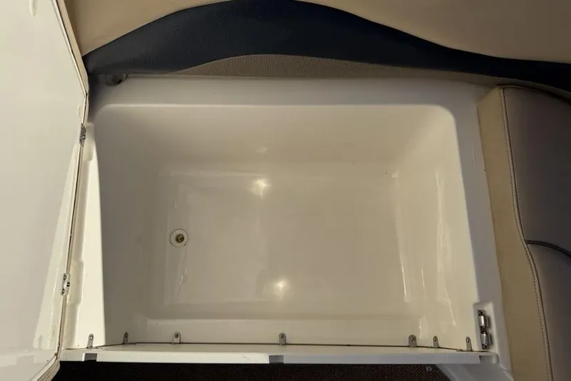 Slide: The Image of 2015 Hurricane SunDeck Sport 202 IO storage compartment, open and empty. - 4