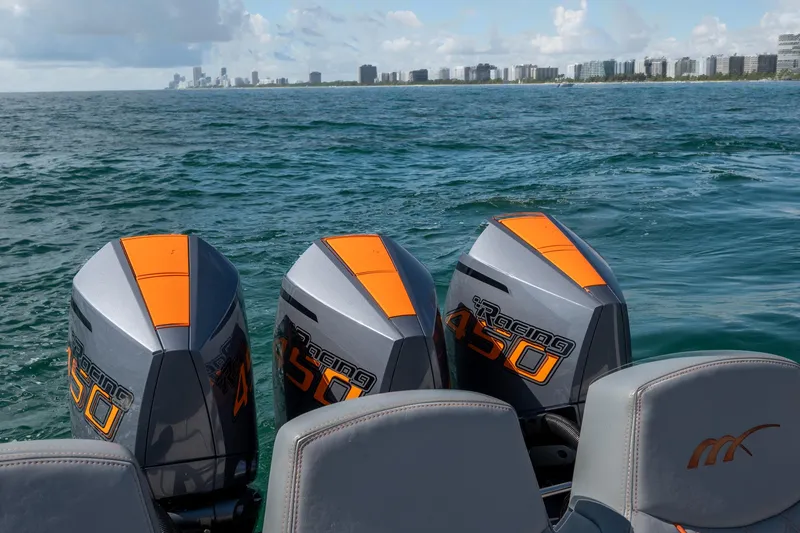 Slide: The Image of 2022 Midnight Express 37' Open boat with powerful engines on open water. - 11