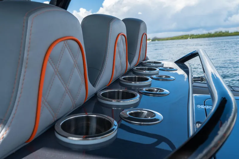 Slide: The Image of Luxury seating and cup holders on 2022 Midnight Express 37' Open boat. - 14