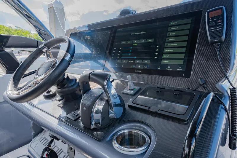 Slide: The Image of Dashboard of 2022 Midnight Express 37' Open boat with modern controls and touchscreen display. - 16