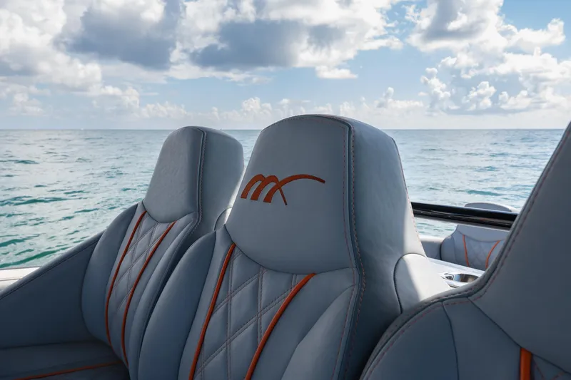 Slide: The Image of Luxury seating on 2022 Midnight Express 37' Open boat with ocean backdrop. - 23