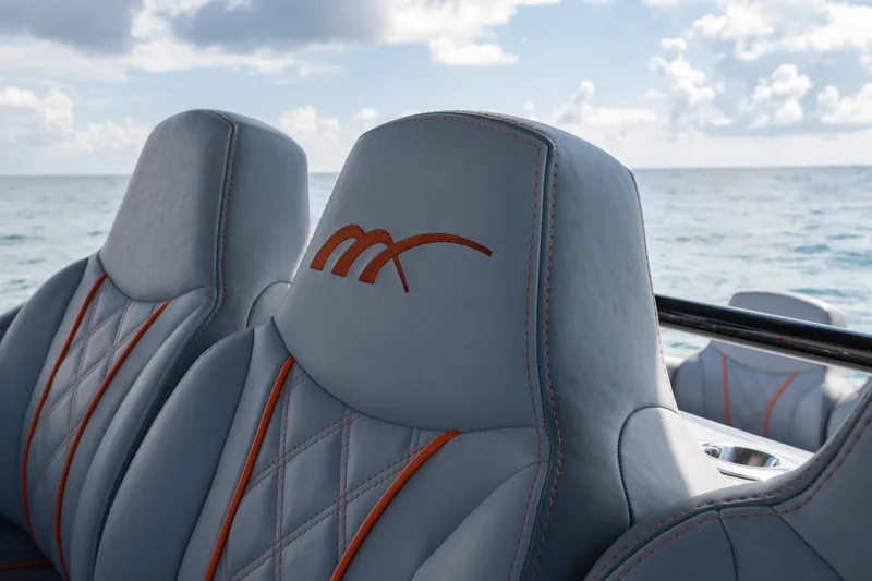 Slide: The Image of Luxury seating on 2022 Midnight Express 37' Open boat with ocean backdrop. - 24