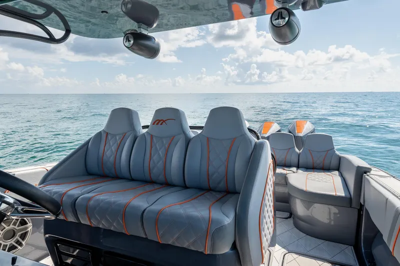 Slide: The Image of Luxurious seating on 2022 Midnight Express 37' Open boat with ocean view. - 25