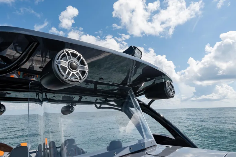 Slide: The Image of 2022 Midnight Express 37' Open boat with speakers, ocean view, and blue sky. - 34