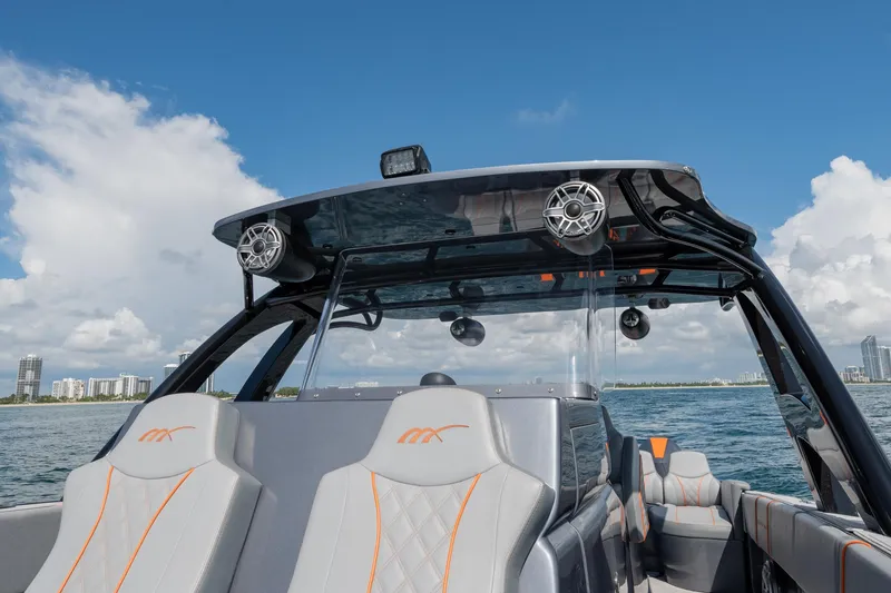 Slide: The Image of 2022 Midnight Express 37' Open boat on water, featuring sleek design and modern seating. - 35