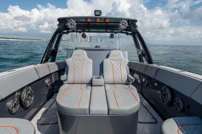 Slide: The Image of 2022 Midnight Express 37' Open boat interior with luxury seating and ocean view. - 36