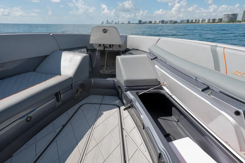 Slide: The Image of 2022 Midnight Express 37' Open boat interior with open storage, ocean view, and city skyline. - 39