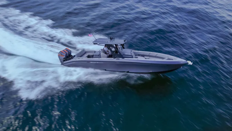 Slide: The Image of 2022 Midnight Express 37' Open boat cruising on open water. - 4
