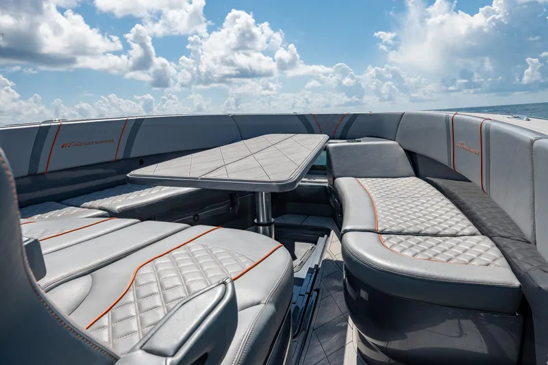 Slide: The Image of Luxurious seating on 2022 Midnight Express 37' Open boat under a bright sky. - 41