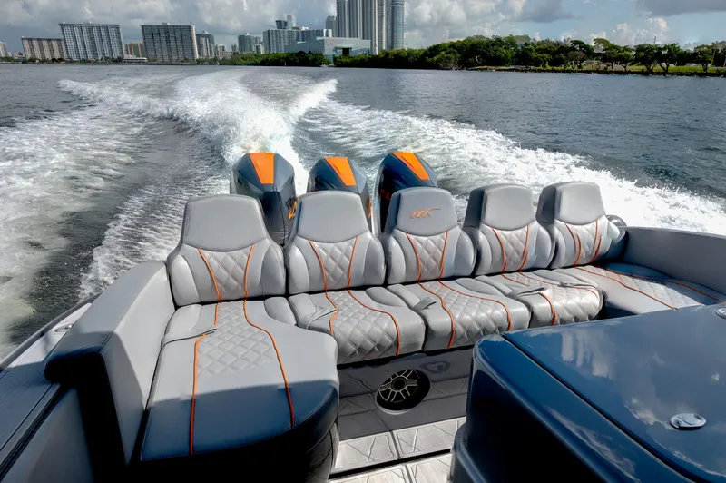 Slide: The Image of 2022 Midnight Express 37' Open boat cruising on water with luxurious seating. - 9