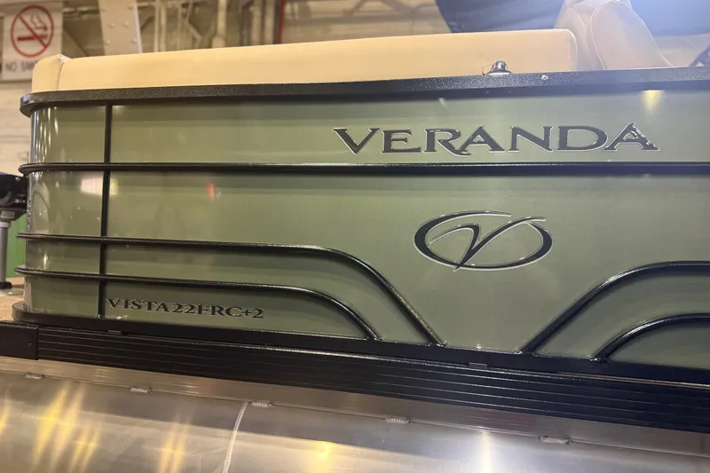 Slide: The Image of 2026 Veranda VISTA 22FRC Tri-toon boat, green exterior with logo and model details. - 4