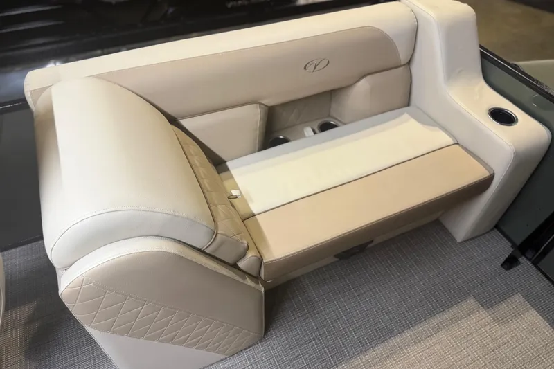 Slide: The Image of Luxurious seating on 2026 Veranda VISTA 22FRC Tri-toon boat, featuring beige upholstery and cup holders. - 6