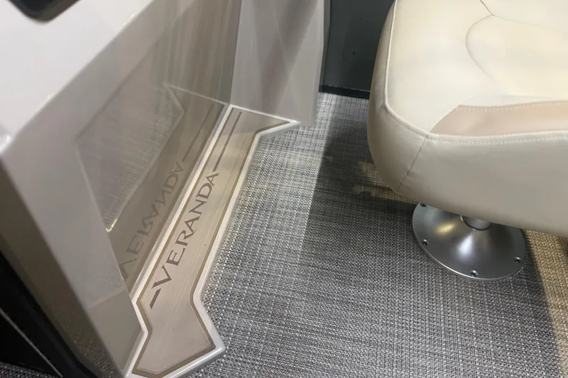 Slide: The Image of Interior of 2026 Veranda VISTA 22FRC Tri-toon with beige seating and branded flooring. - 8