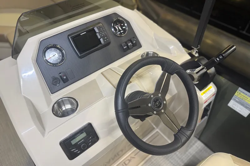 Slide: The Image of 2026 Veranda VISTA 22FRC Tri-toon dashboard with steering wheel and control panel. - 9