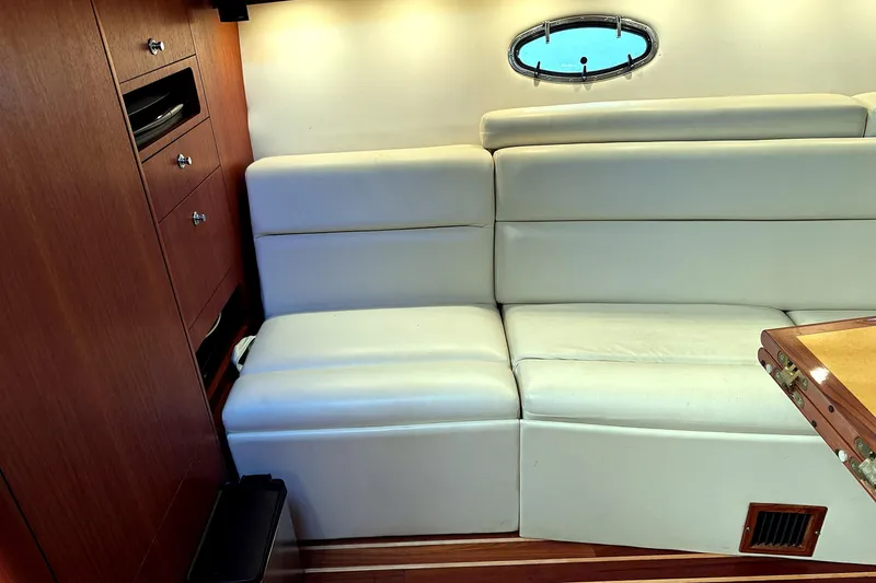 Slide: The Image of Luxurious interior of 2004 Tiara Yachts 4200 Open with white leather seating. - 10