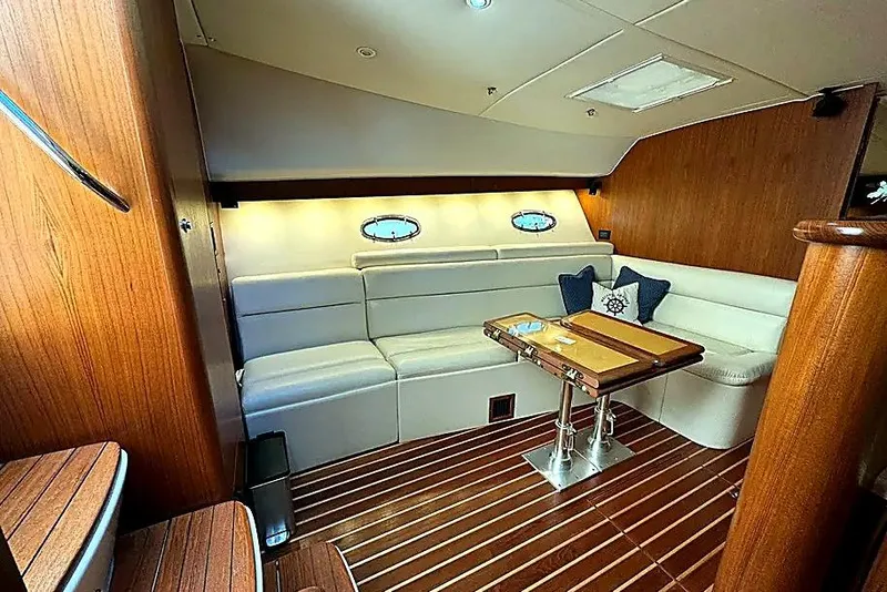 Slide: The Image of Luxurious interior of 2004 Tiara Yachts 4200 Open with elegant seating and wooden accents. - 15