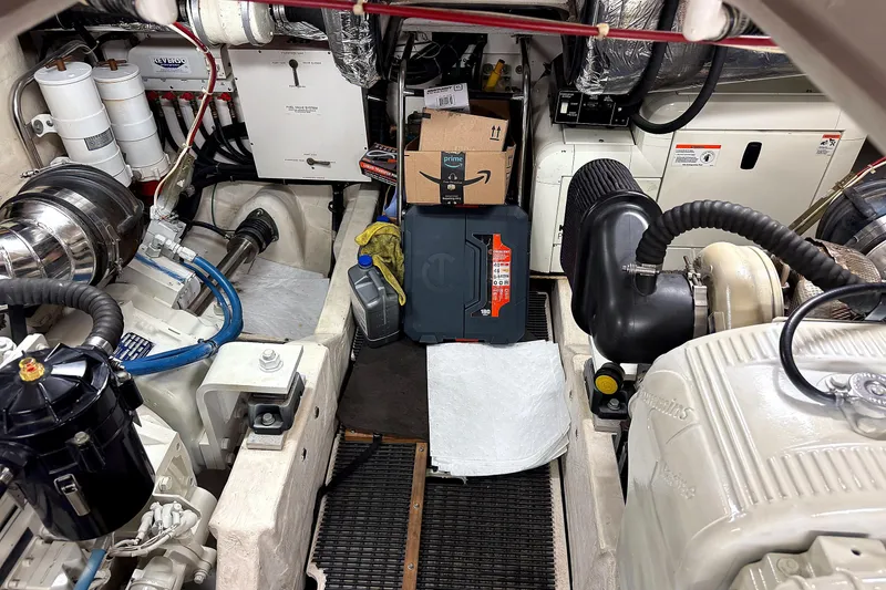 Slide: The Image of Engine room of a 2004 Tiara Yachts 4200 Open, showcasing mechanical components and storage. - 19