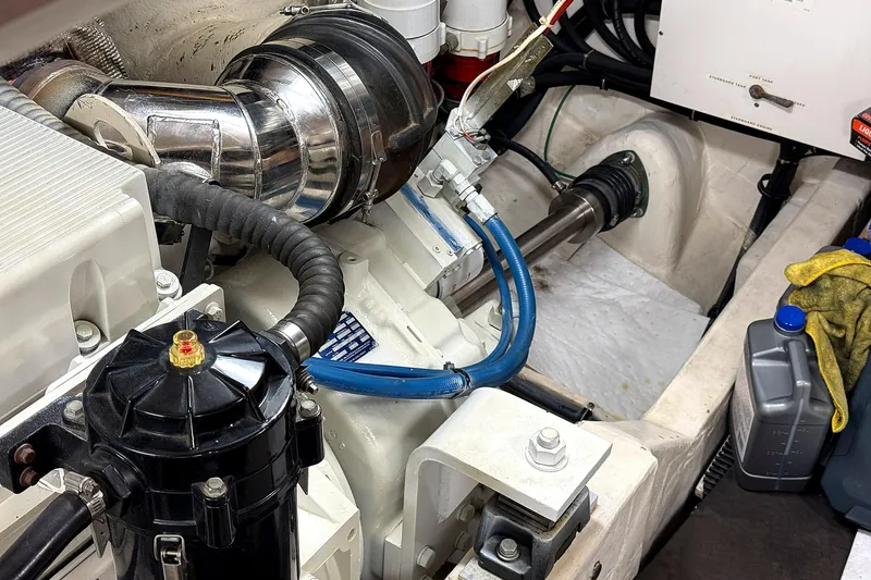 Slide: The Image of Engine compartment of a 2004 Tiara Yachts 4200 Open, showcasing mechanical components and fluid containers. - 20