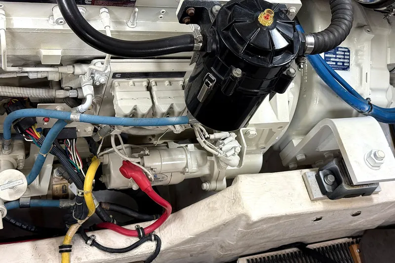 Slide: The Image of Engine compartment of a 2004 Tiara Yachts 4200 Open, showcasing wiring and components. - 21