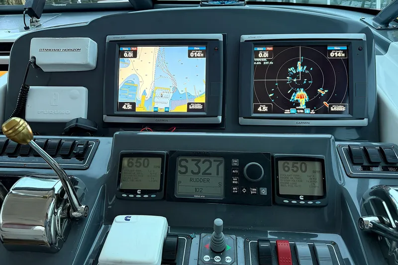 Slide: The Image of Dashboard of a 2004 Tiara Yachts 4200 Open with navigation and control systems. - 5