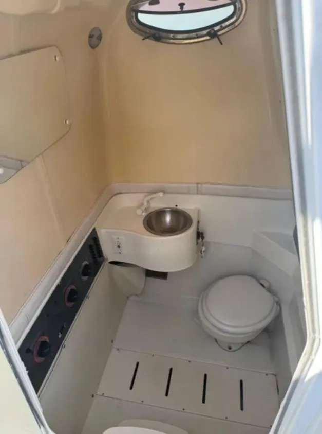 Slide: The Image of 2004 Hydra-Sports Vector 33 CC boat bathroom with sink and toilet. - 10