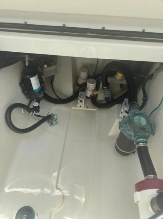 Slide: The Image of 2004 Hydra-Sports Vector 33 CC engine compartment with hoses and components. - 11