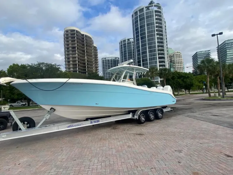 Slide: The Image of 2004 Hydra-Sports Vector 33 CC boat on trailer, urban background with tall buildings. - 2