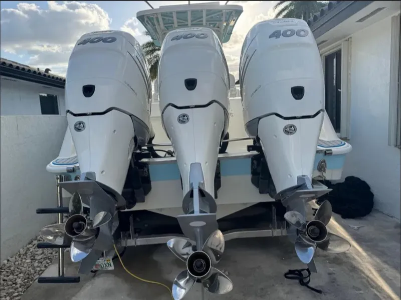 Slide: The Image of Triple outboard engines on a 2004 Hydra-Sports Vector 33 CC boat. - 3