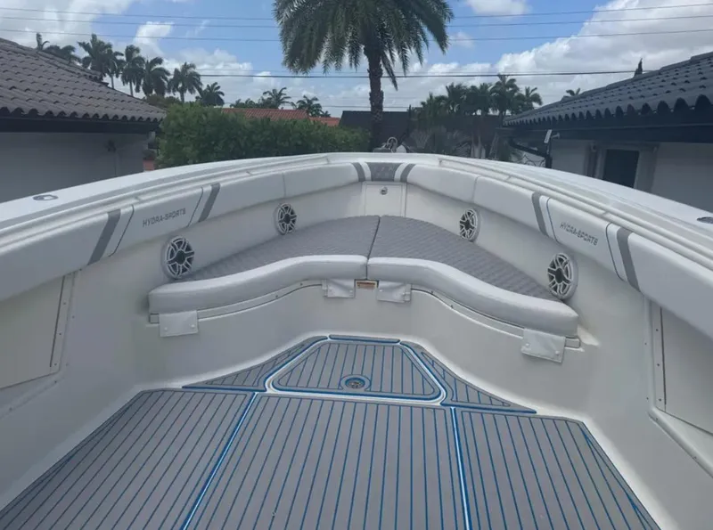 Slide: The Image of 2004 Hydra-Sports Vector 33 CC boat interior with cushioned seating and speakers. - 4