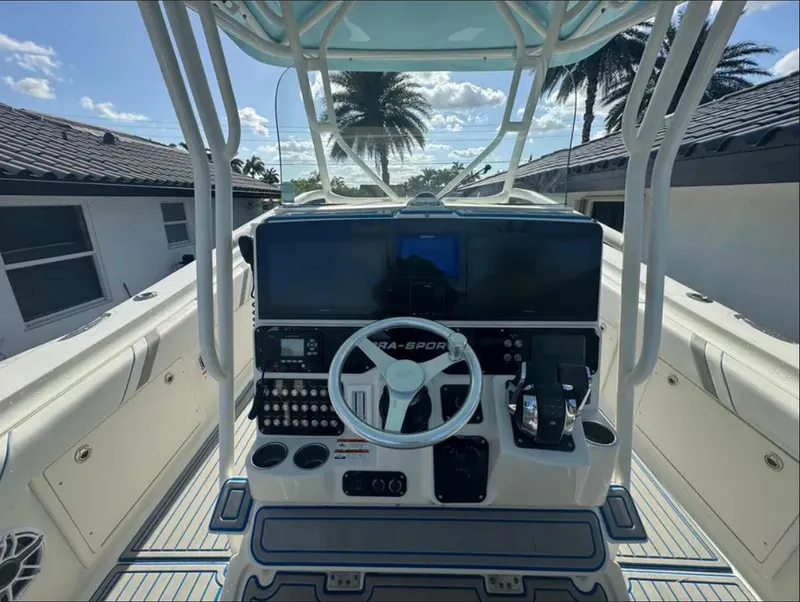 Slide: The Image of 2004 Hydra-Sports Vector 33 CC boat console with steering wheel and controls. - 6