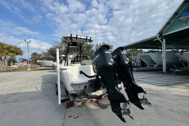 Slide: The Image of 2022 Sea Born LX24 Center Console boat with dual Suzuki 140 outboard motors. - 13