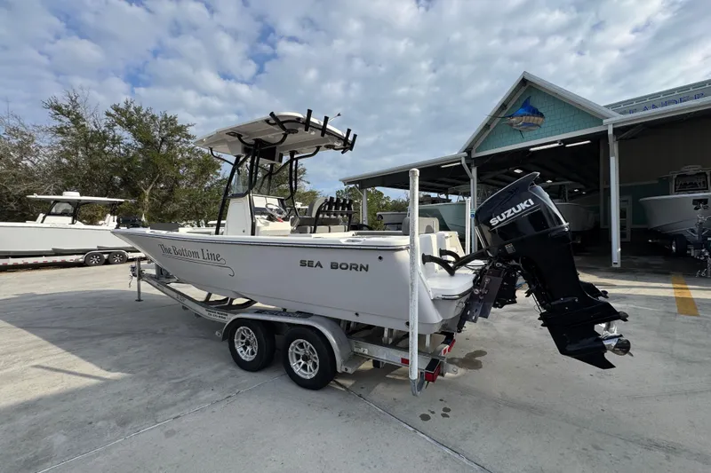 Slide: The Image of 2022 Sea Born LX24 Center Console boat on trailer with Suzuki outboard motor. - 14
