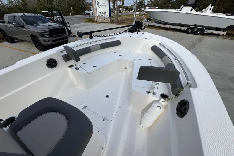Slide: The Image of 2022 Sea Born LX24 Center Console boat interior with seating and storage compartments. - 15