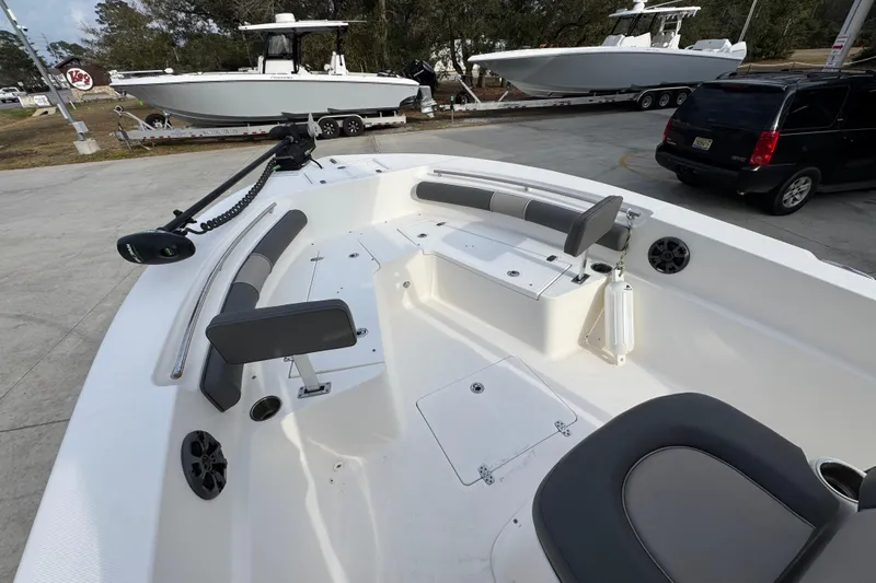 Slide: The Image of 2022 Sea Born LX24 Center Console boat interior with seating and storage compartments. - 17