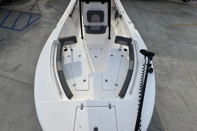 Slide: The Image of 2022 Sea Born LX24 Center Console boat with spacious deck and seating. - 19