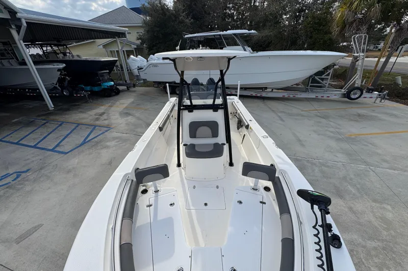 Slide: The Image of 2022 Sea Born LX24 Center Console boat in a marina setting. - 20