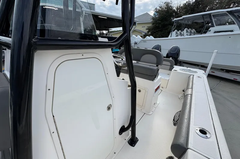 Slide: The Image of 2022 Sea Born LX24 Center Console boat interior with seating and console details. - 22