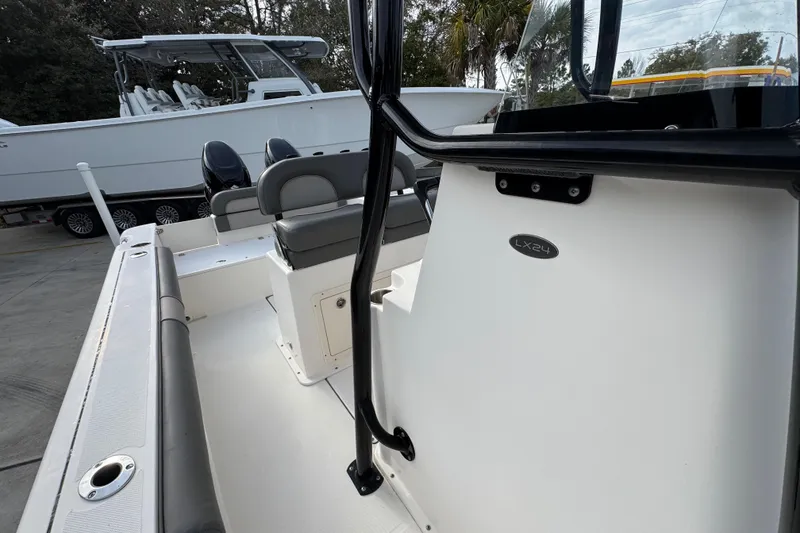 Slide: The Image of 2022 Sea Born LX24 Center Console boat interior with seating and console details. - 23