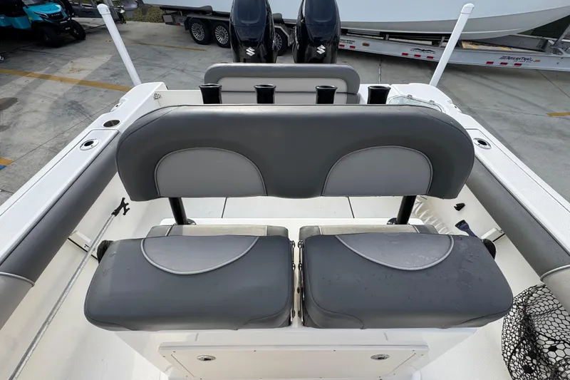 Slide: The Image of 2022 Sea Born LX24 Center Console boat with dual seats and rod holders. - 25