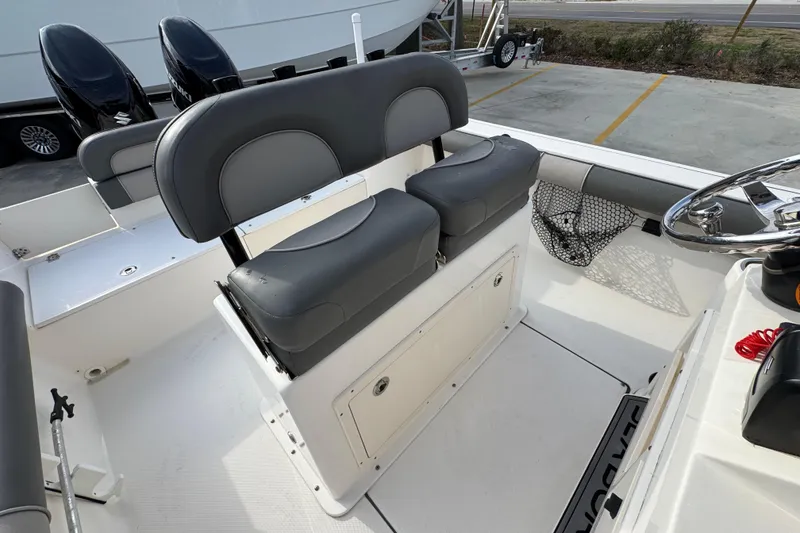 Slide: The Image of 2022 Sea Born LX24 Center Console boat interior with dual seats and steering wheel. - 31