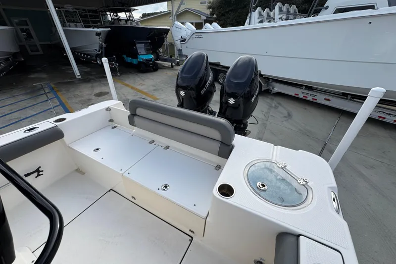 Slide: The Image of 2022 Sea Born LX24 Center Console boat with dual Suzuki outboard motors. - 34