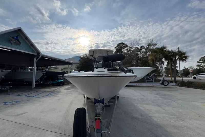 Slide: The Image of 2022 Sea Born LX24 Center Console boat on trailer under cloudy sky. - 5